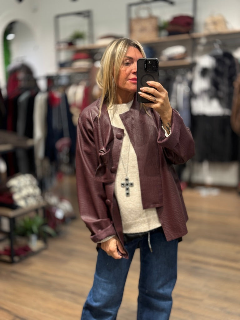 Giacca in ecopelle con fiocco