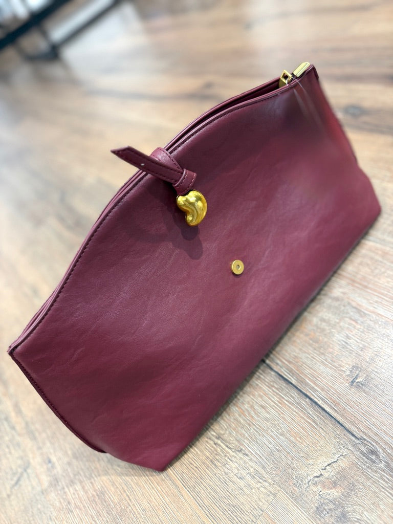 Borsa a mano con chiusura in metallo oro