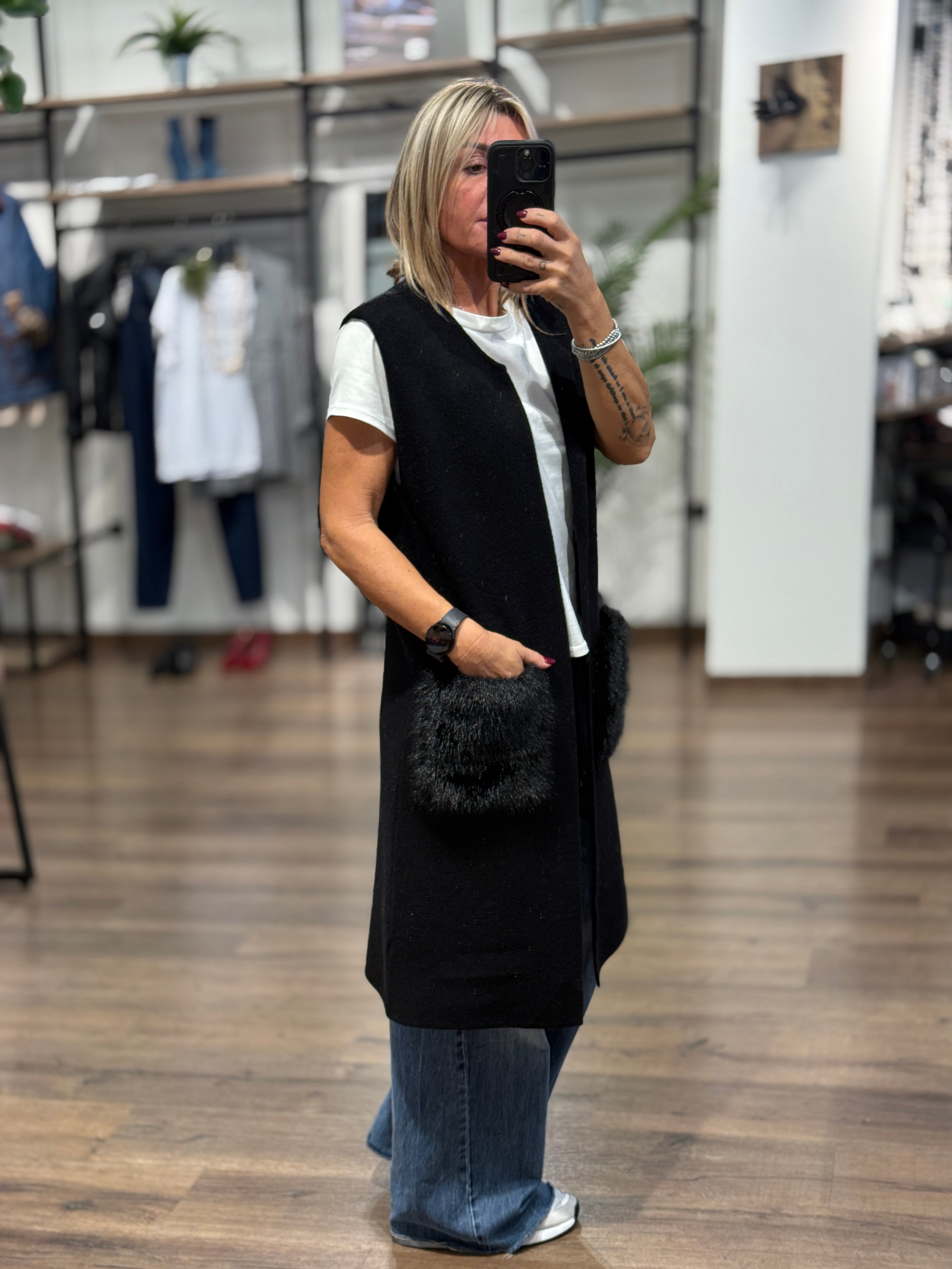 Gilet lungo in maglia con tasche in ecopelo