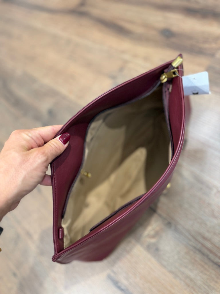 Borsa a mano con chiusura in metallo oro