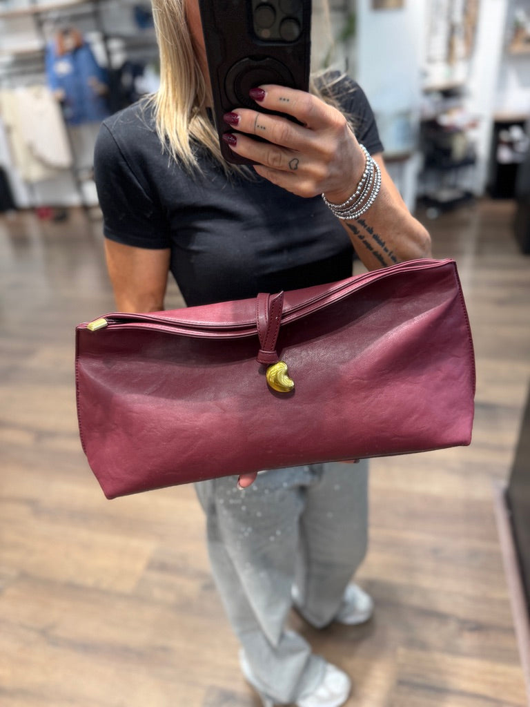Borsa a mano con chiusura in metallo oro